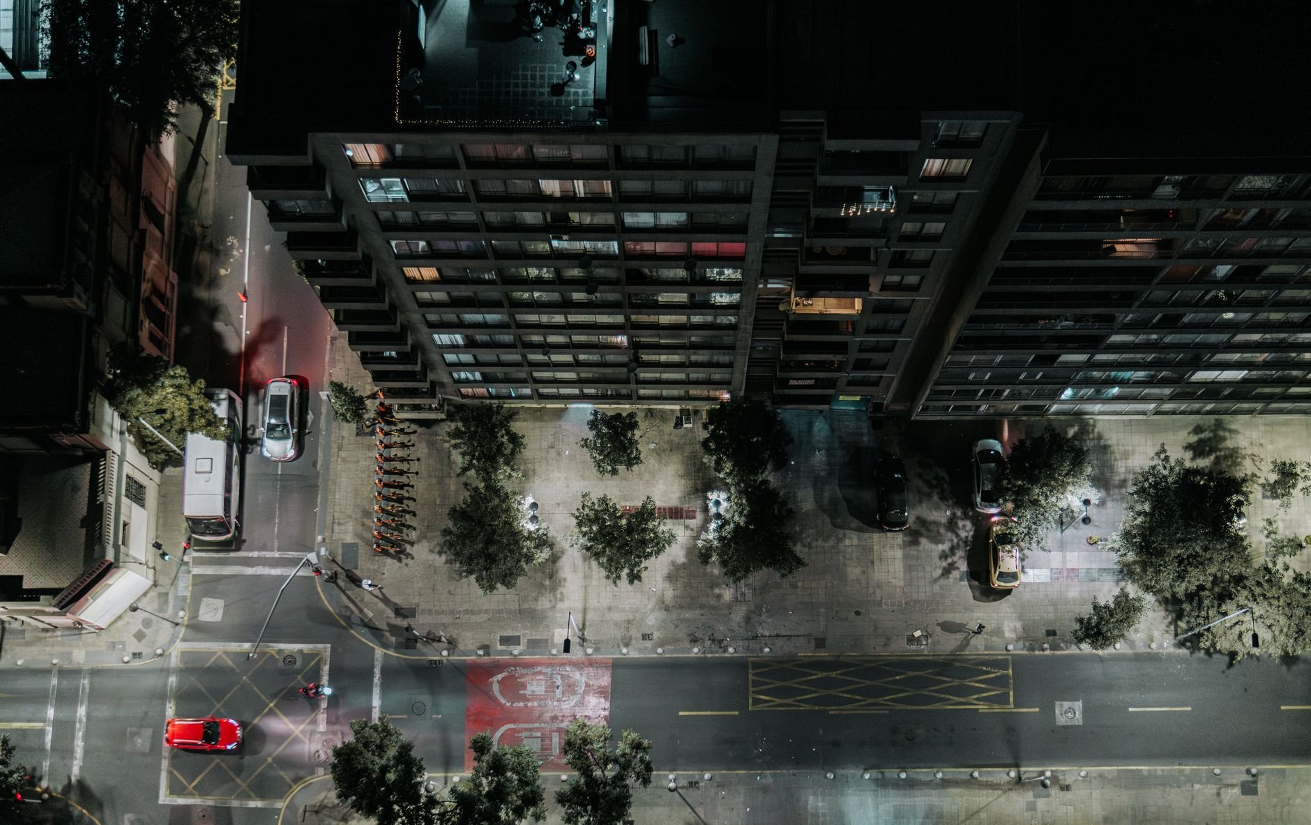 Aerial cityscape at night showcasing a busy street in Santiago, Chile with illuminated skyscrapers and traffic.